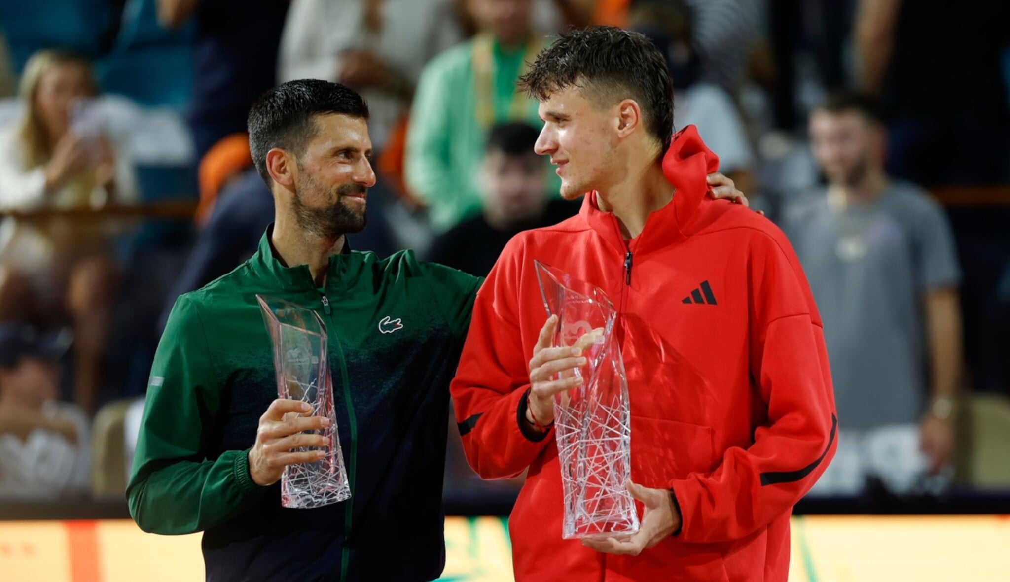 Novak Djokovic (SRB) hugs Jakub Mensik (CZE)
